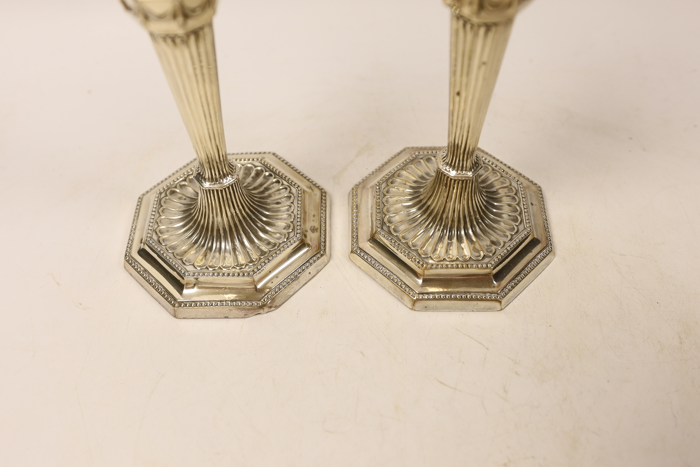A pair of George V silver mounted candlesticks, on octagonal bases, Mappin & Webb, Sheffield, 1929, 20.9cm, weighted.